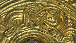 Zoomorph biting its own back, detail from a seventh-century gold brooch, Fitzwilliam Museum M.63-1904