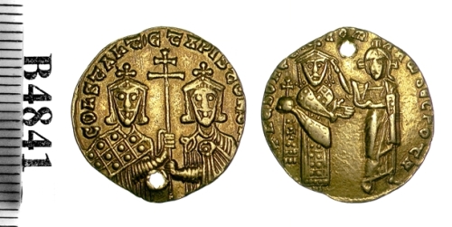 Pierced gold solidus of Emperor Romanus I, showing him being crowned by Christ, with his son-in-law Constantine VII and his son Christopher sharing a cross on the reverse. Struck in Constantinople between 919 and 931, though narrower guesses have been made; Barber Institute of Fine Arts B4841