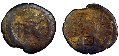 A copper twenty-nummi probably struck by Emperor Anastasius (491-518) or Justin I (518-527), very worn and bearing an Islamic countermark, from the Mardin Hoard, Barber Institute of Fine Arts MH0123