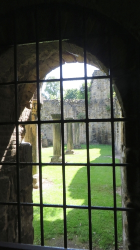 Window view onto a courtyard at Kirkstall Abbey