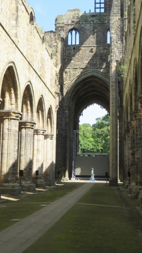 View from the west end of the north aisle of the church eastwards at Kirkstall Abbey