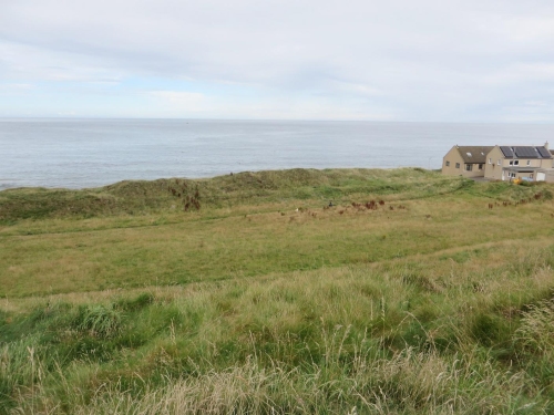 View from the inner rampart of Burghead hillfort to the middle rampart and the Moray Firth