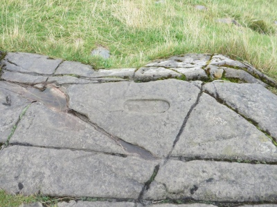 Carved footprint in the supposed inauguration stone at Dunadd