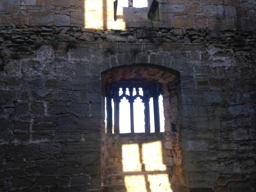 The setting sun shining onto the eastern interior wall of the Marmion Tower