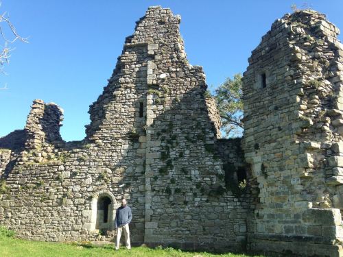 Historian Jonathan Jarrett standing before the ruins of Pendragon Castle